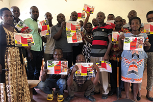 Isingiro district stakeholders with Abel Walekhwa holding the RVF flyer developed with funding from the IAA award Isingiro district stakeholders with Abel Walekhwa holding the RVF flyer developed with funding from the IAA award