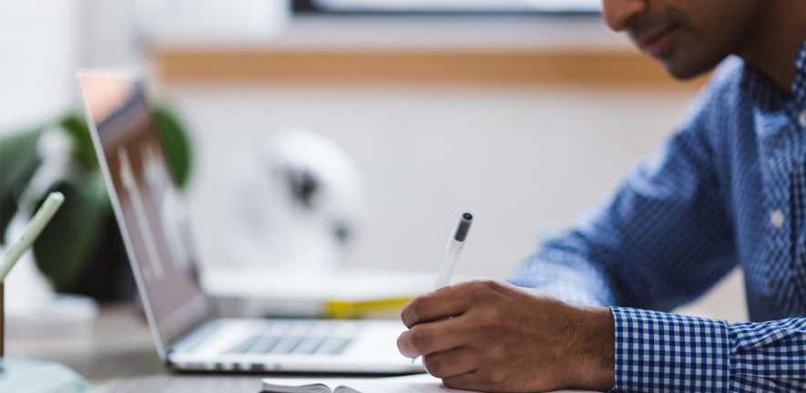 Credit: StockSnap from Pixabay man writing and laptop