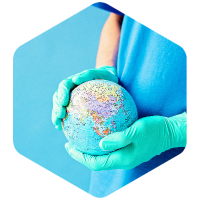 Mikhail Nilov on Pexels doctor hands holding globe