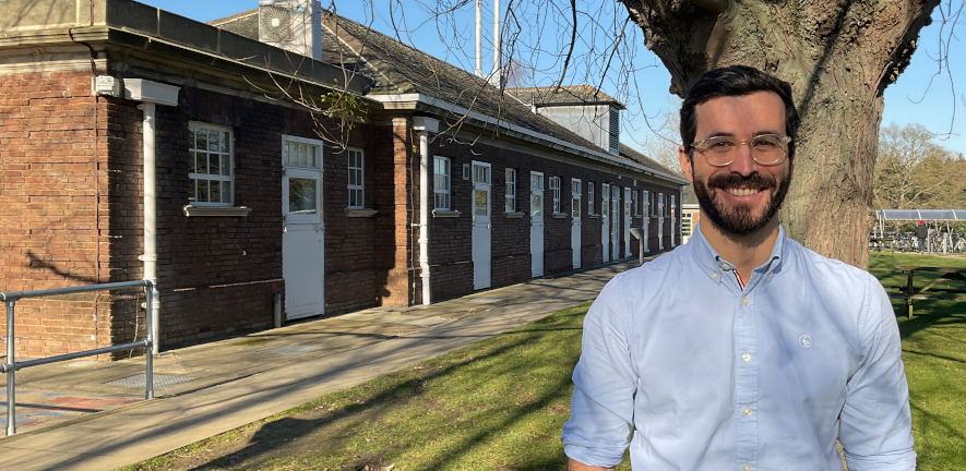 Jose Novo Matos Jose Novo Matos, in a shirt, stood smiling in front of a tree and a brick building